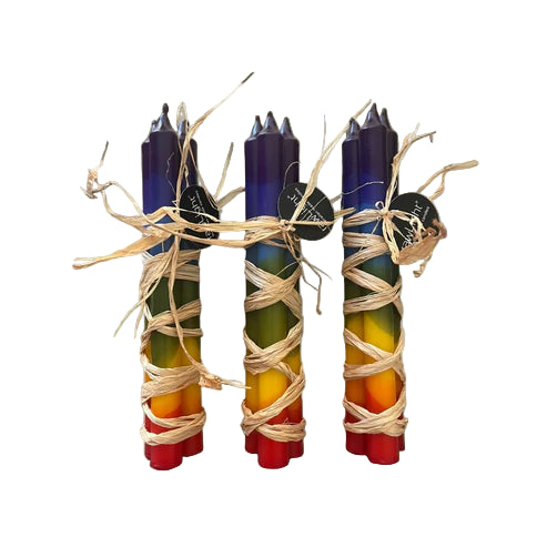 Set of colorful candles with natural fiber wrapping on a neutral background
