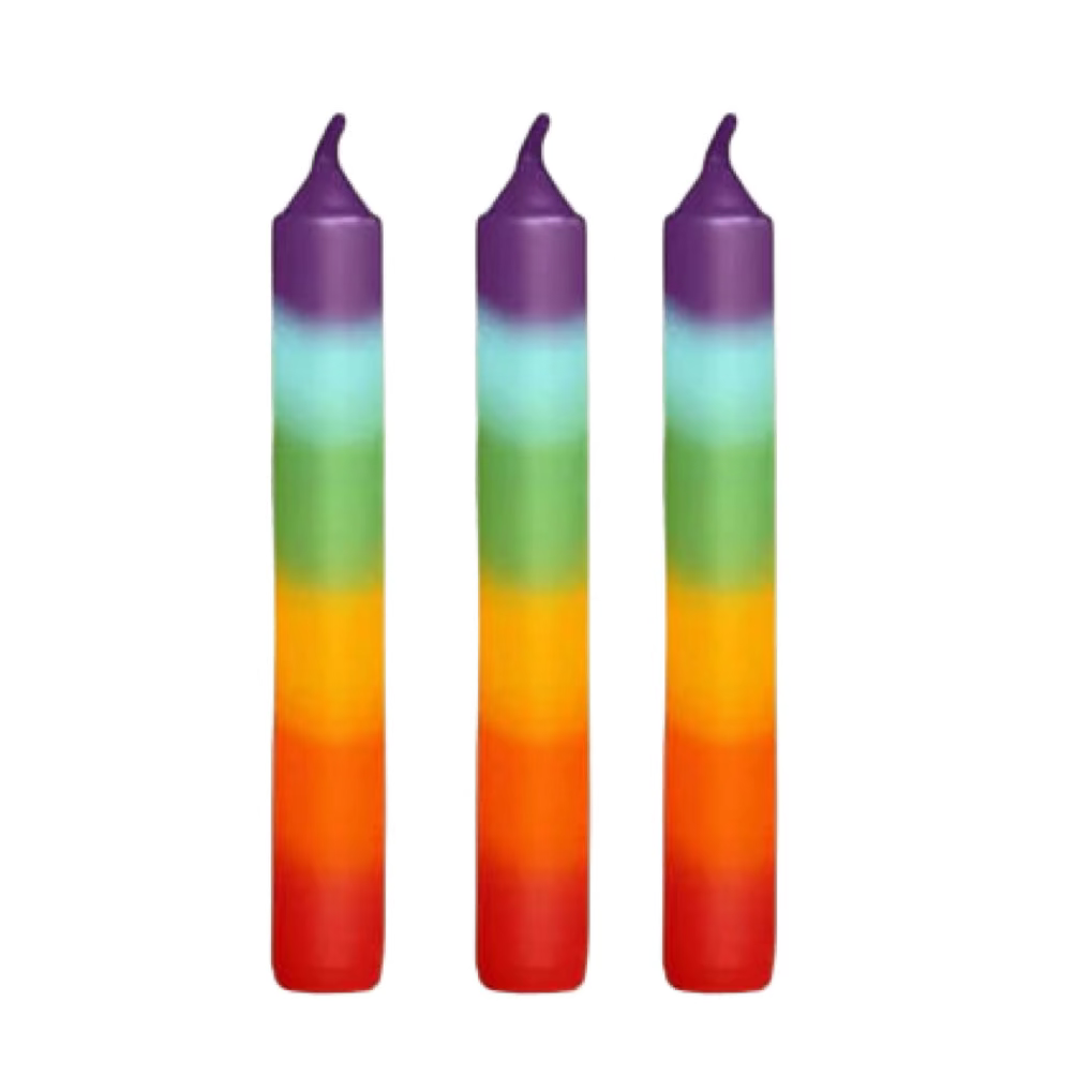 Three gradient candles from purple to red on a white background