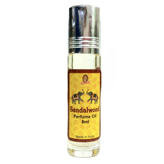 Sandalwood perfume oil bottle with yellow label and silver cap on white background