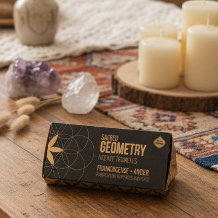 Box of Sacred Geometry incense triangles on a wooden surface