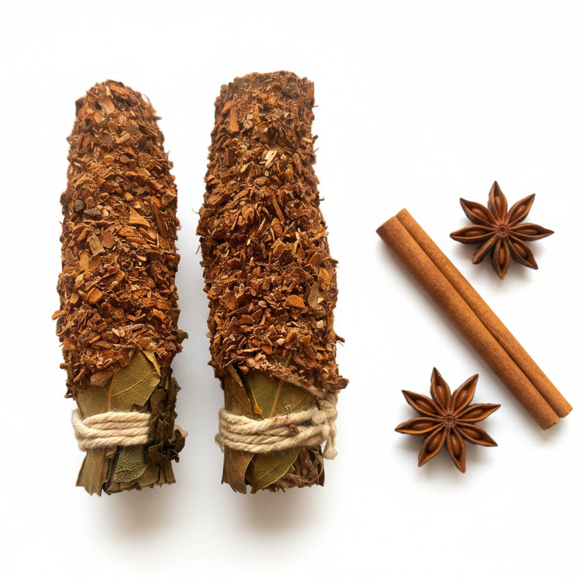 Twosmudge sticks tied with rope on a white background