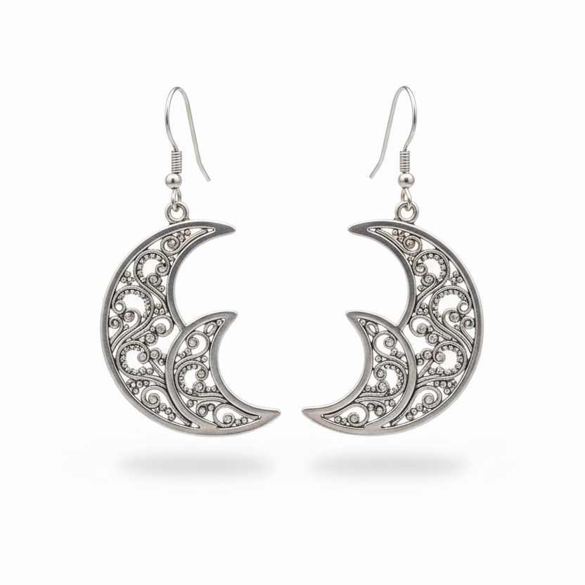 Silver crescent moon earrings on a white background