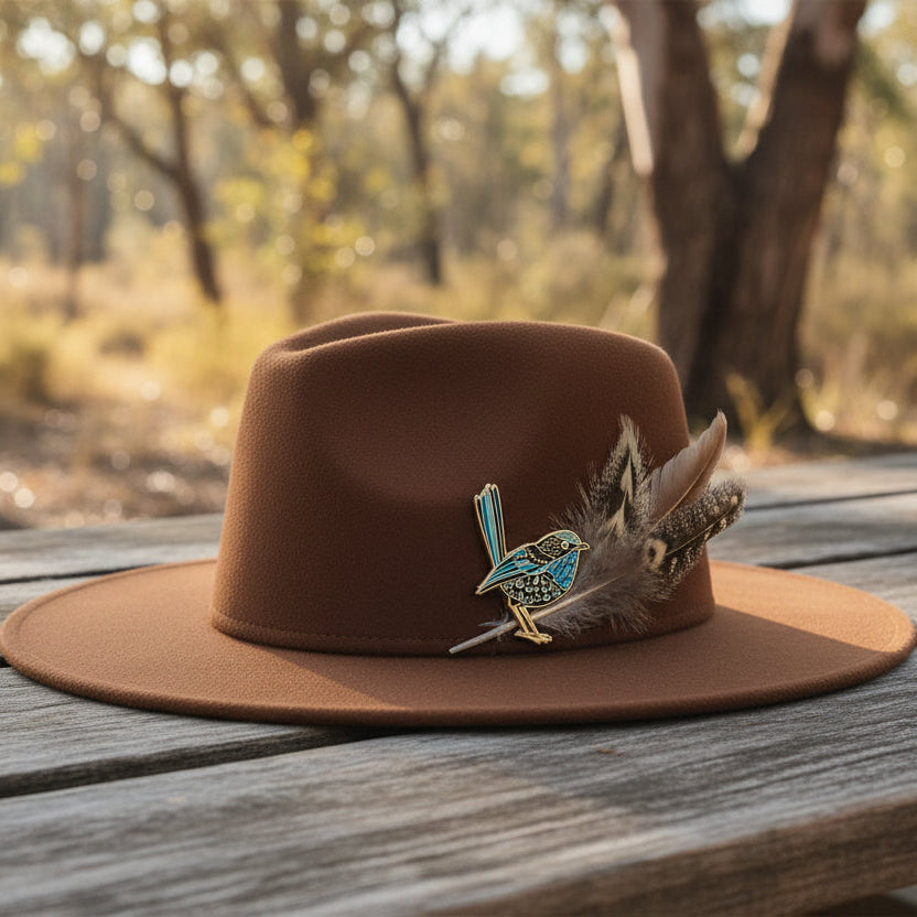 Enamel pin of a splendid fairy-wren on a hat