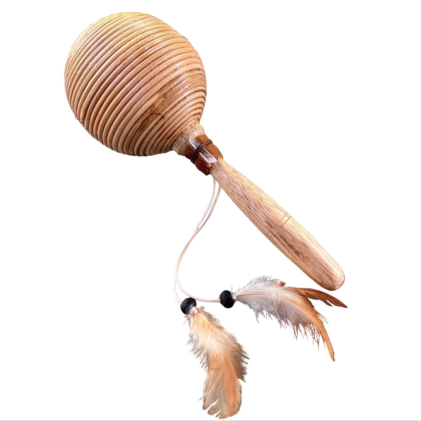 A wooden maraca or shamanic shaker with a ribbed oval head, a light wood handle, and two hanging feathers attached by white cords with black beads