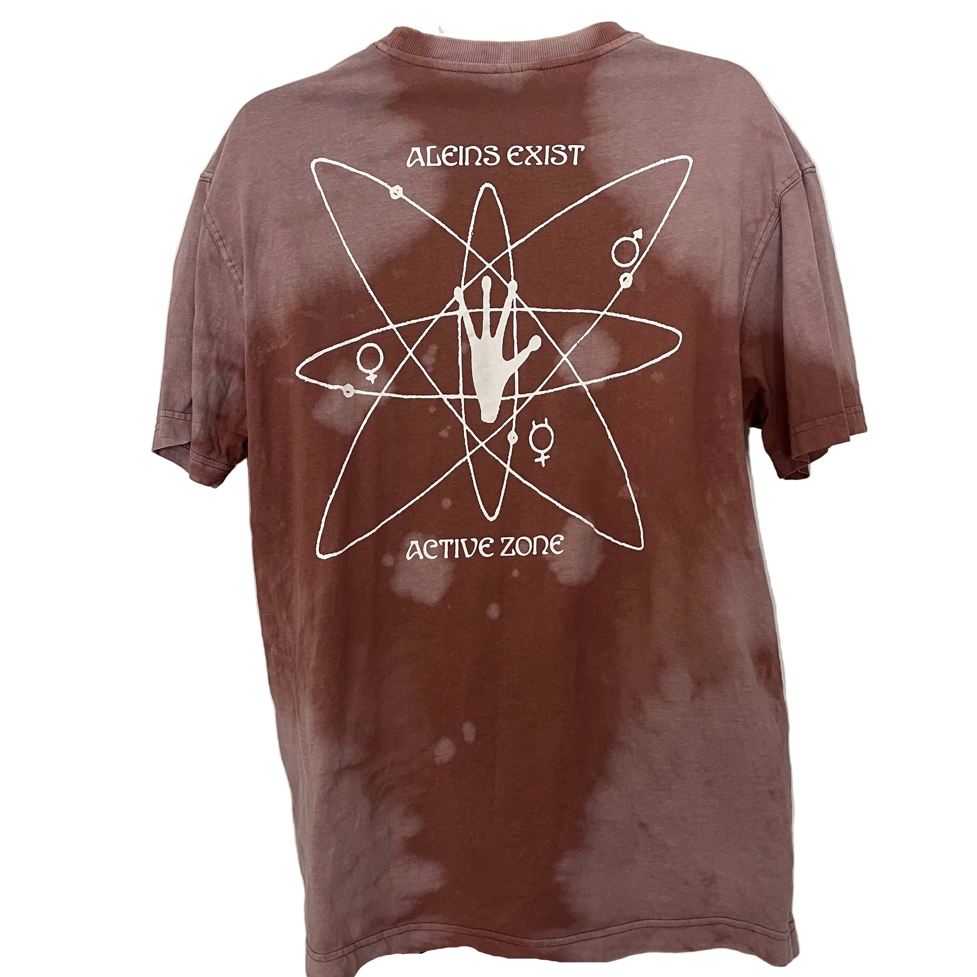 Brown t-shirt with white graphic design and text on a white door background