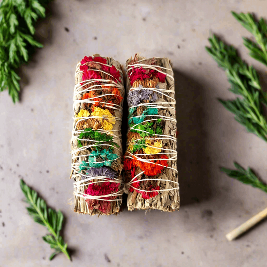 White sage smudge stick with chakra flowers