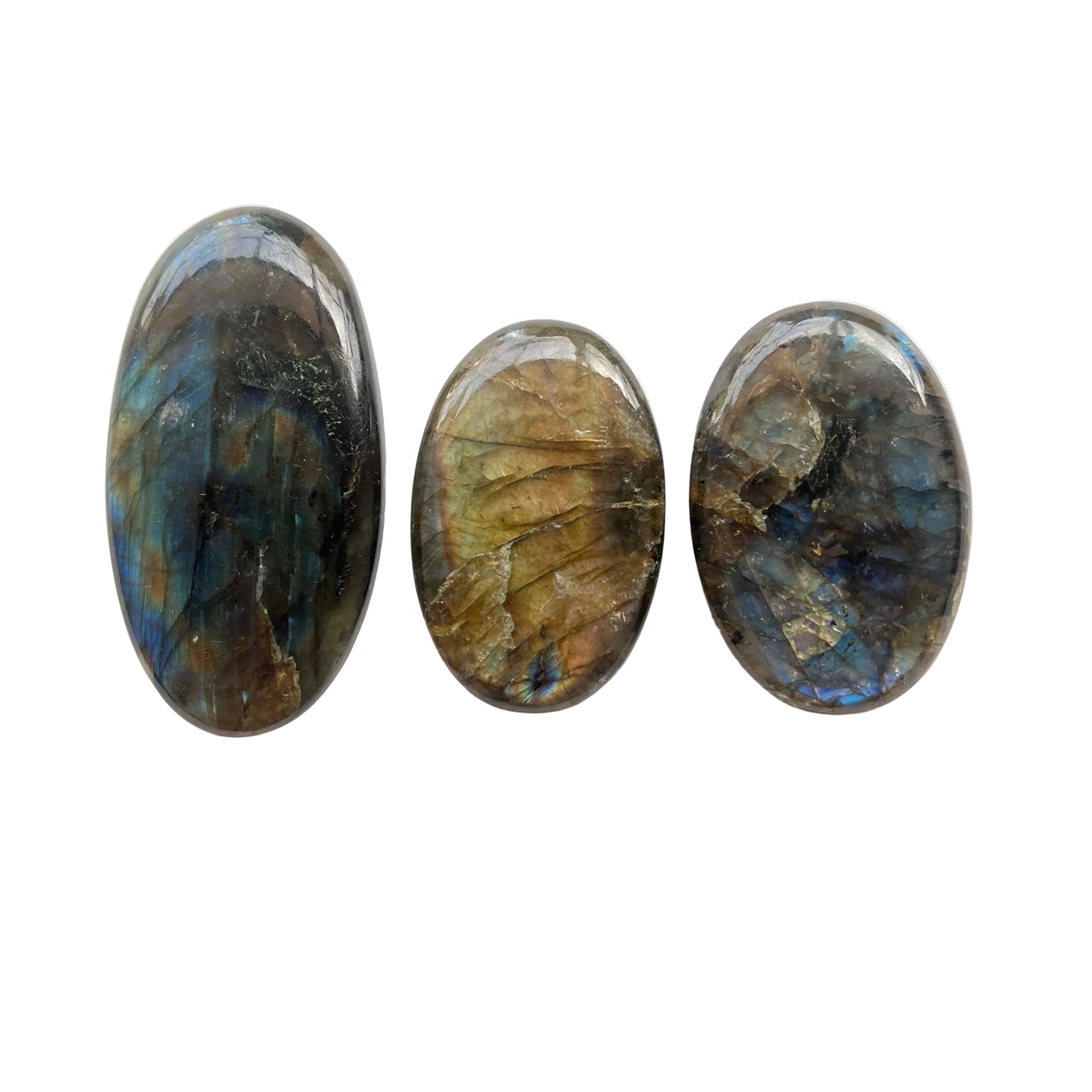 Three labradorite stones on a white background