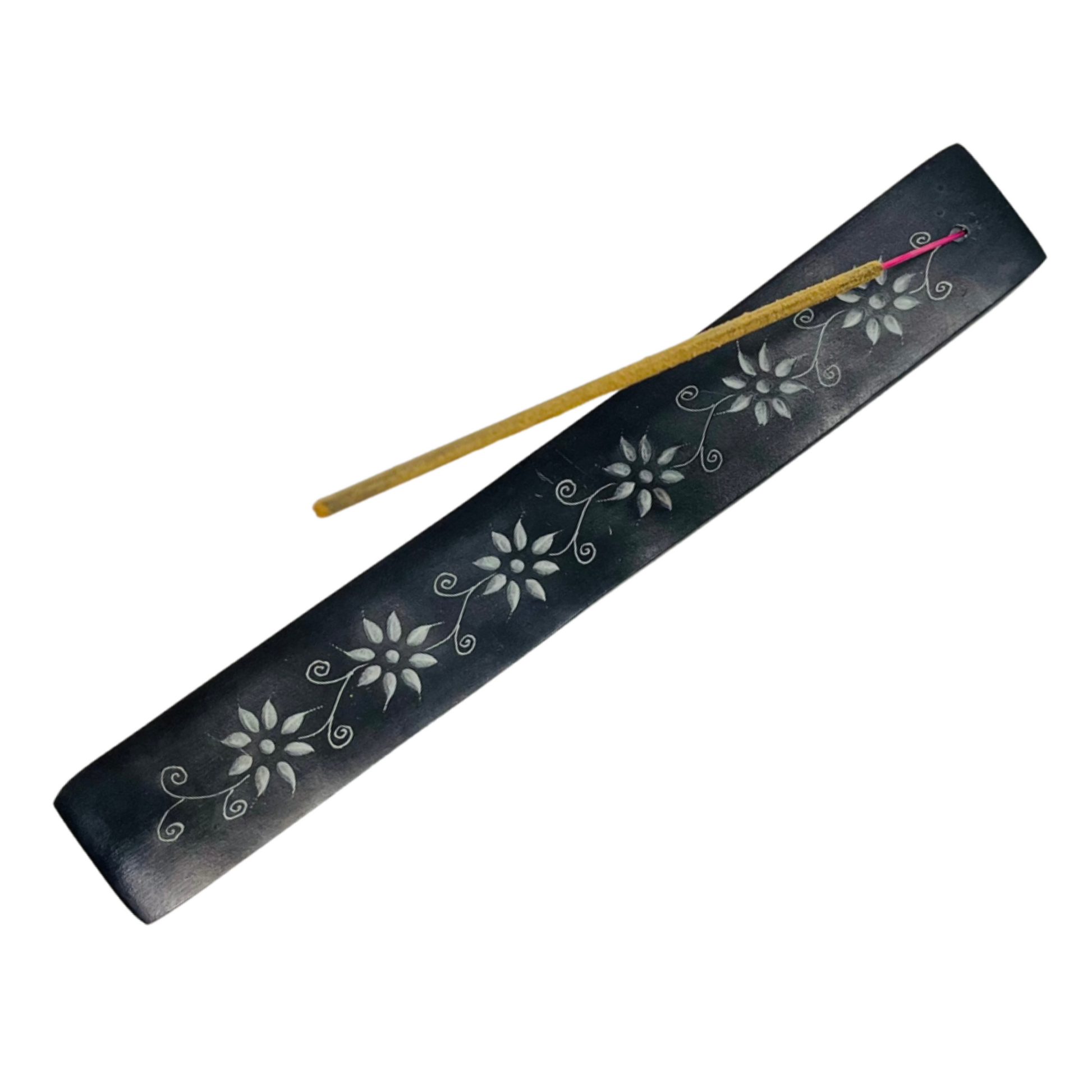 Black incense holder with floral designs and two incense sticks on a white background