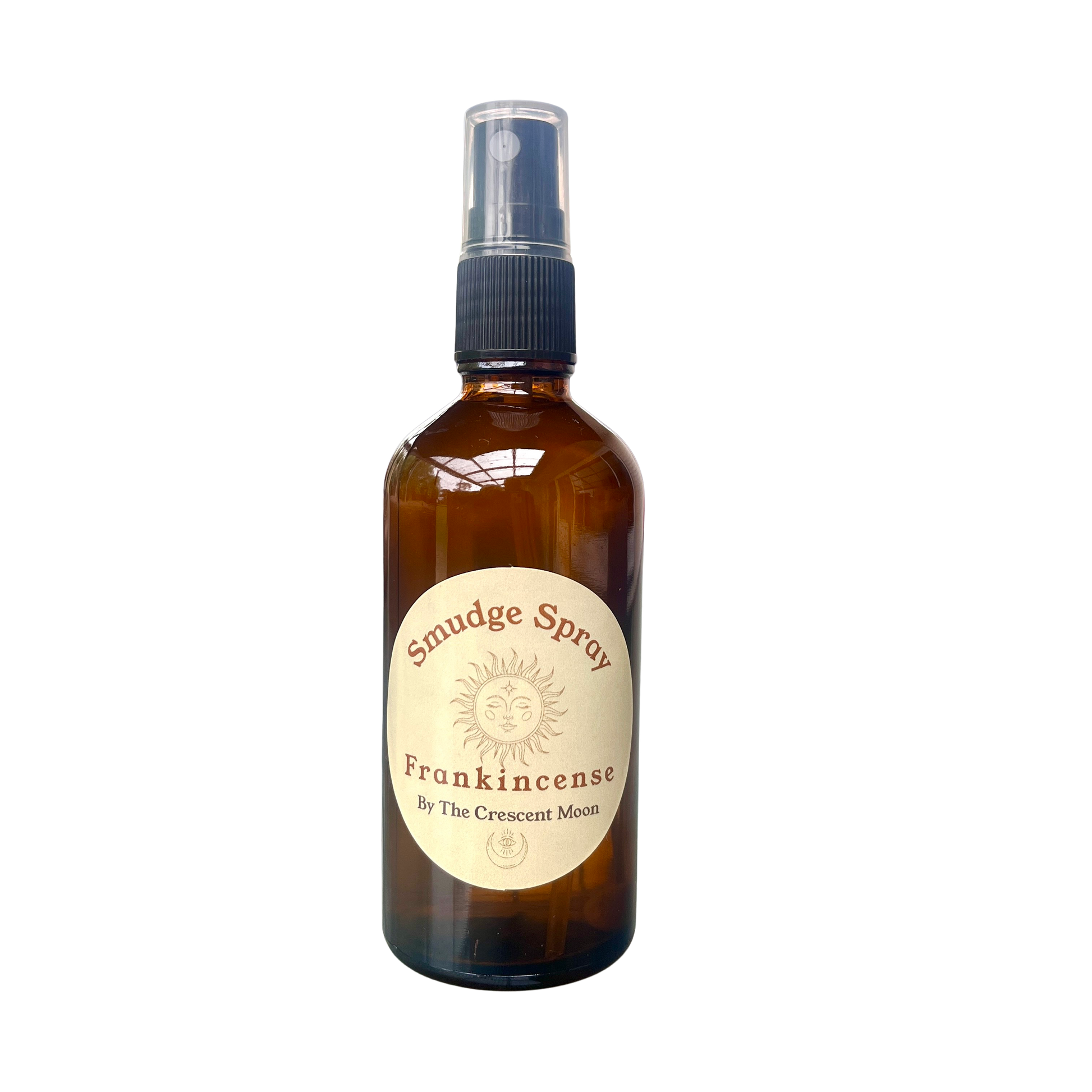 Brown glass bottle with a spray top labeled 'Smudge Spray Frankincense' by The Crescent Moon on a white background.