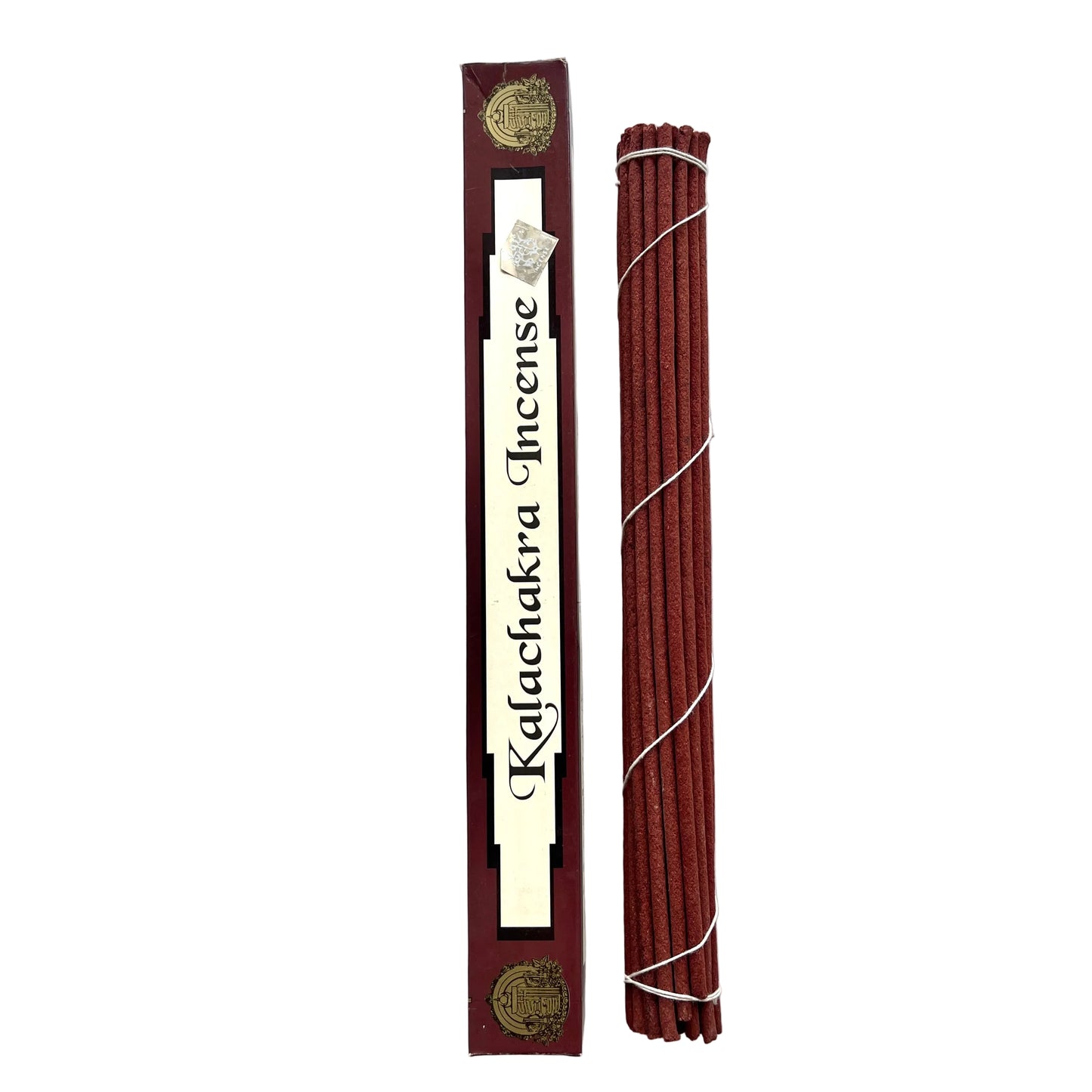 Kalachakra incense sticks with packaging on a textured white background