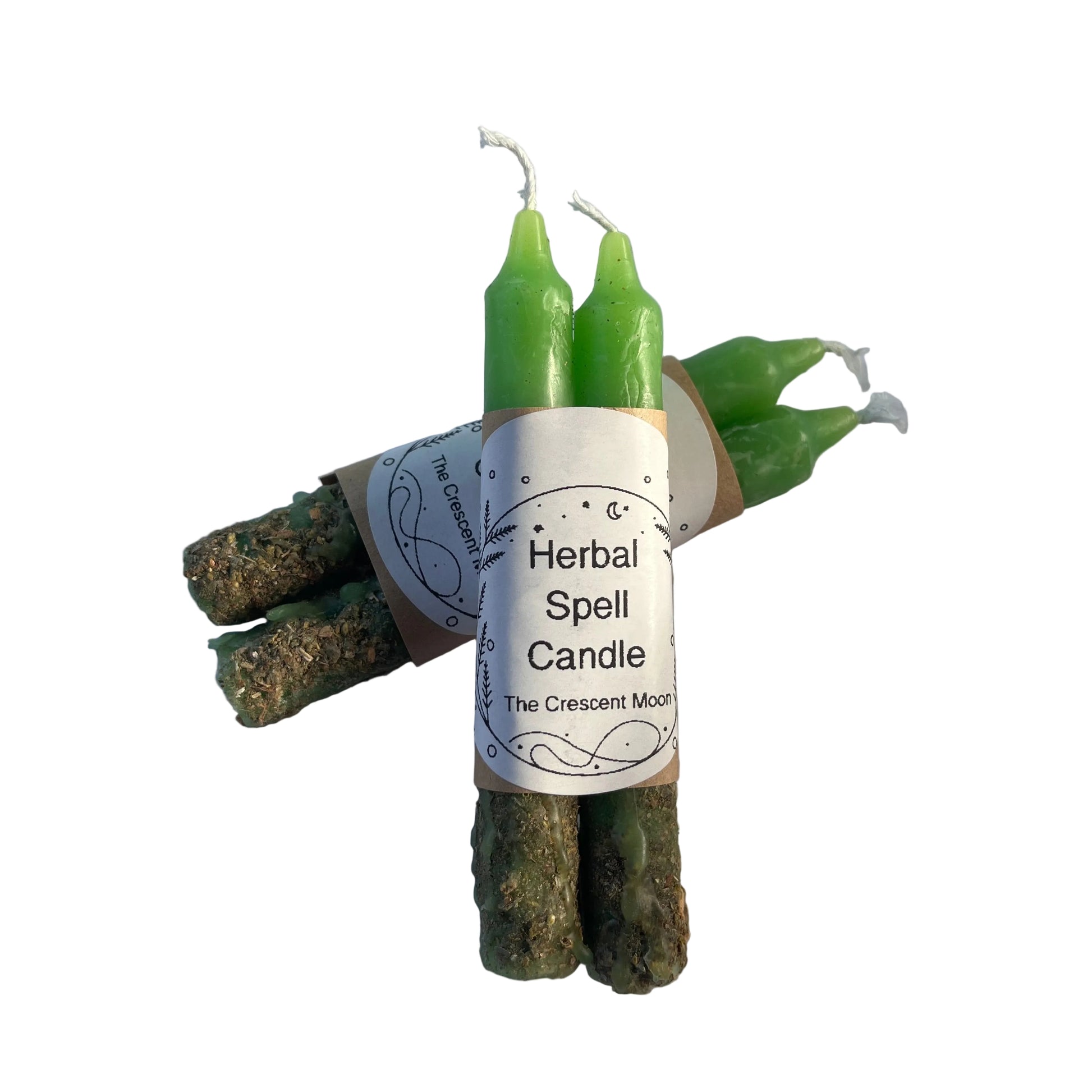 green herbal spell candles