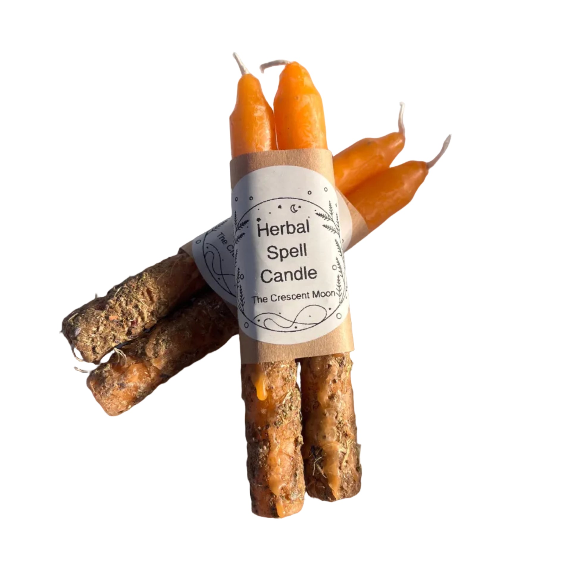 orange spell candles with herbs