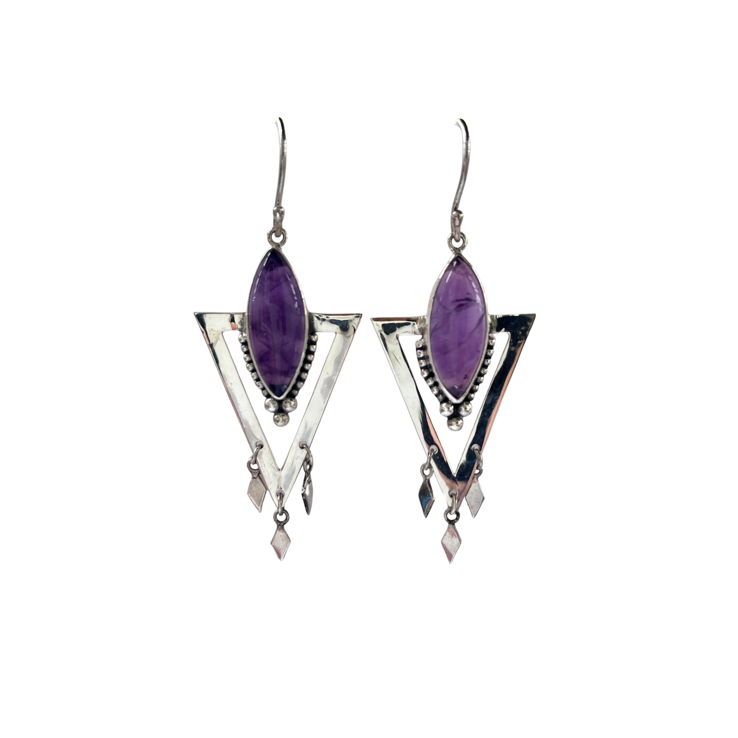 Pair of silver earrings with purple gemstones on a white background