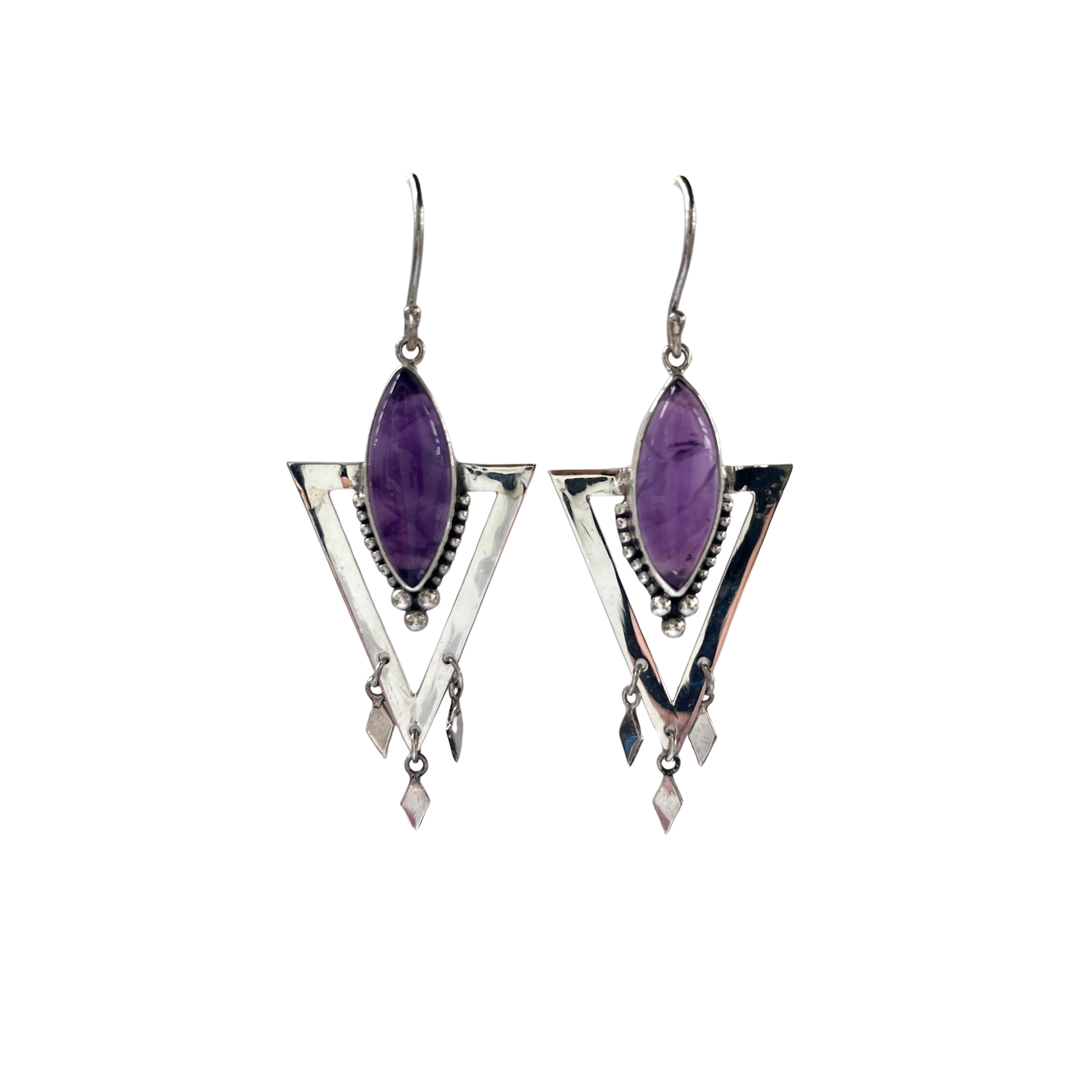 Pair of silver earrings with purple gemstones on a white background