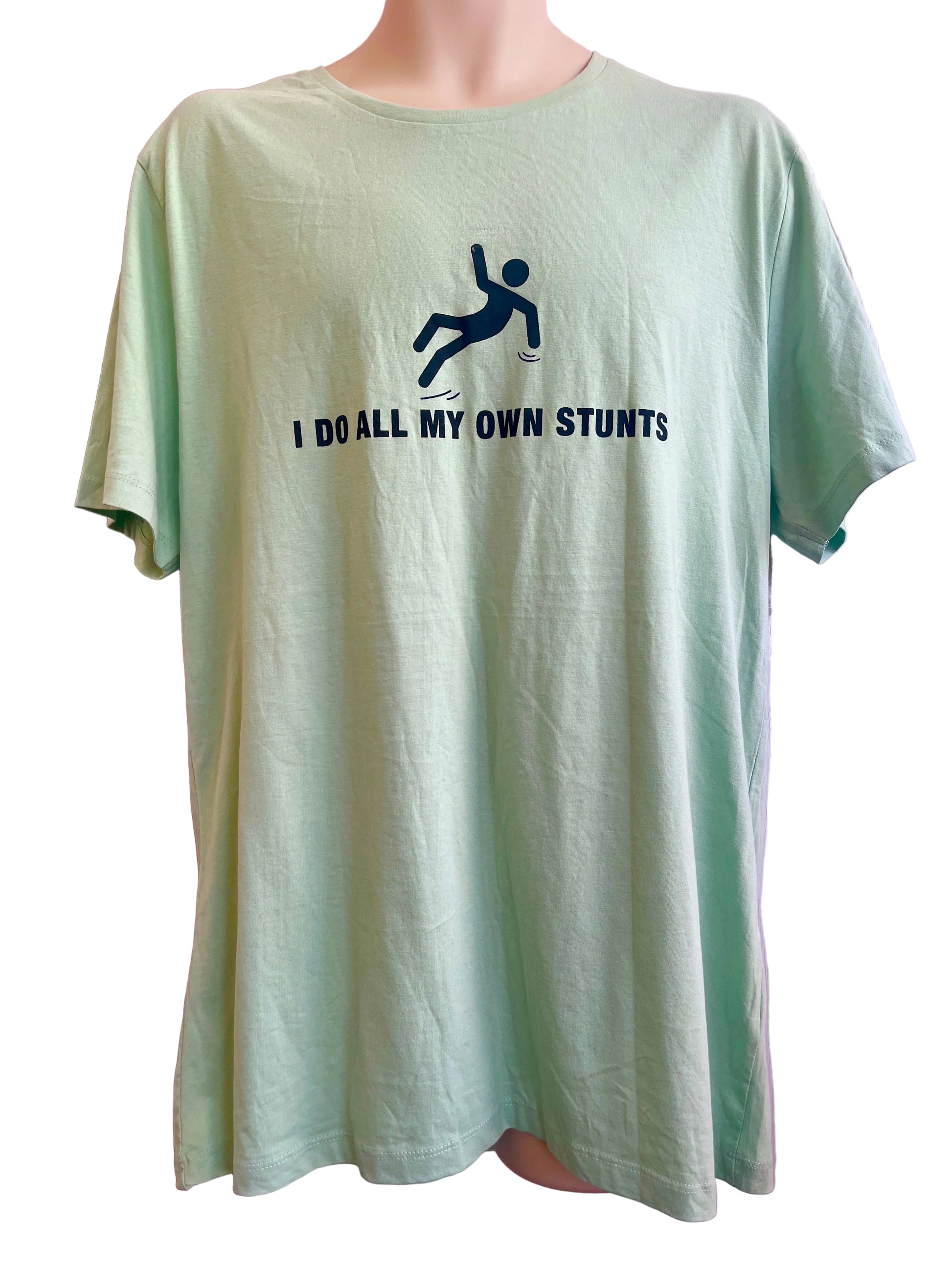 Light green t-shirt with graphic and text on a mannequin