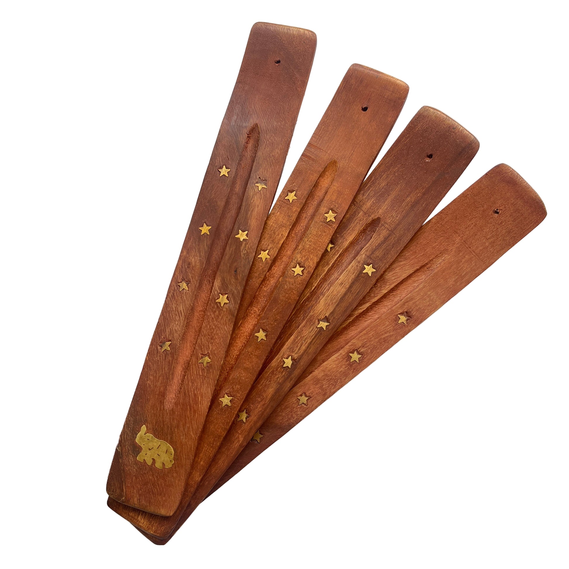 Set of wooden incense sticks with star and bear designs on a light background