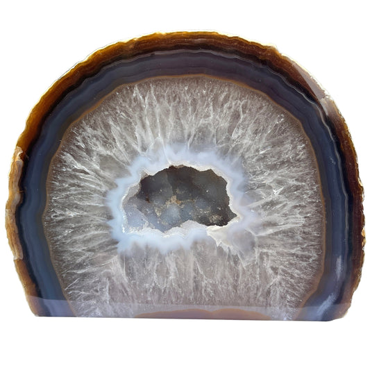 Agate Geode with concentric layers on a white surface
