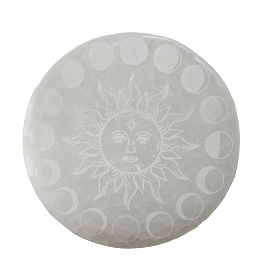 sELENITE PLATE with sun and moon phases engraving on a plain background
