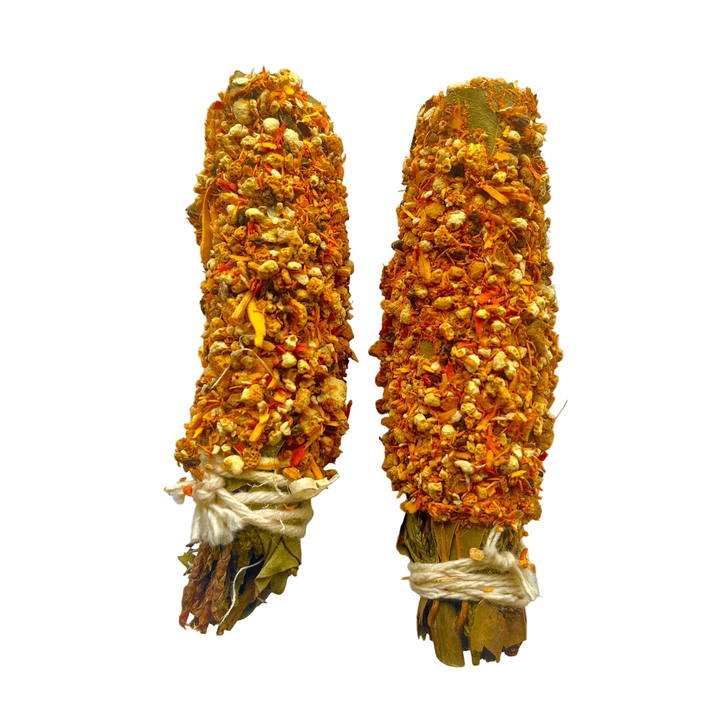 Two smudge sticks made of dried herbs and twigs on a white background