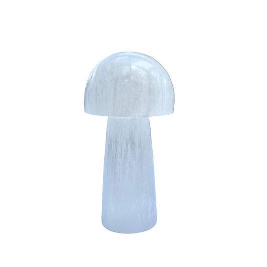 White marble mushroom sculpture on a white surface 