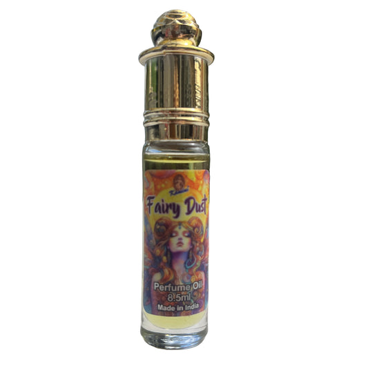 Fairy Dust perfume oil bottle with colorful label on a reflective surface