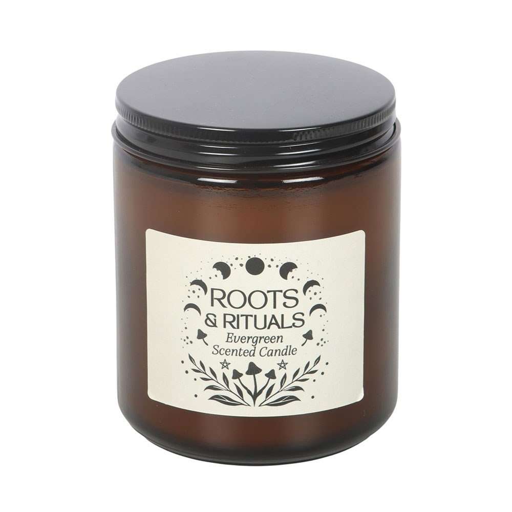Brown candle jar with black lid and 'Roots & Rituals' label on a white background