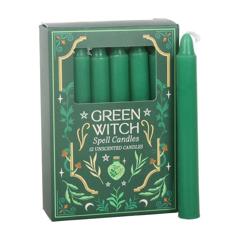 Green Witch spell candles in a decorative box on a white background