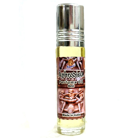 Three bottles of Aphrodisia perfume oil on a white background