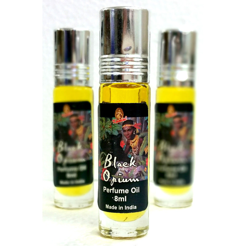 Three bottles of Black Opium perfume oil with a visible label on a white background