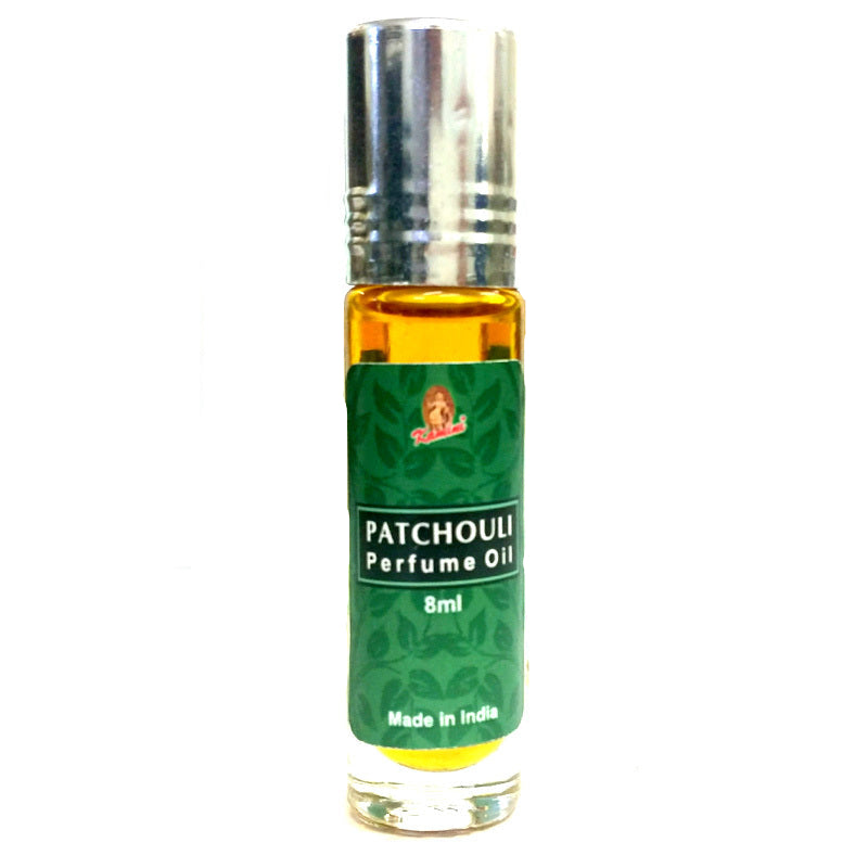 Three bottles of Patchouli perfume oil with green labels on a white background