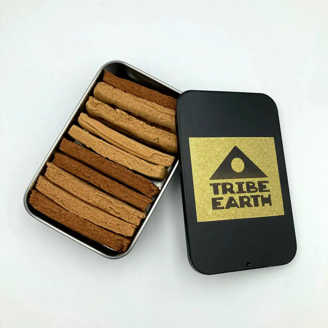 Black tin with incense planks and 'Tribe Earth' logo on a white background