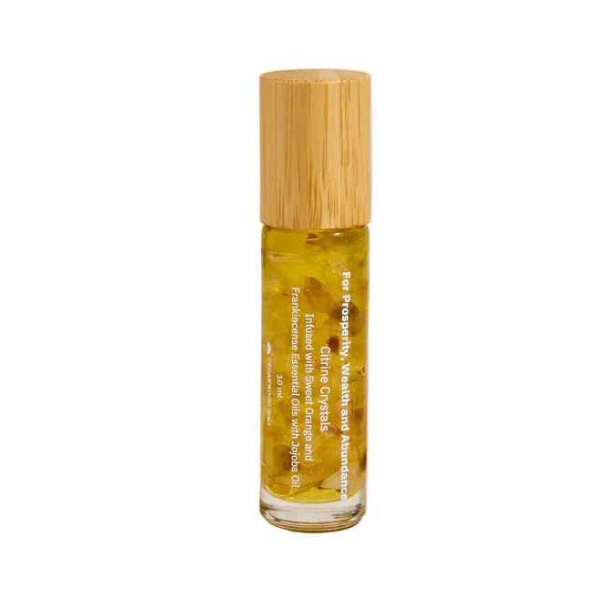 Cryster wellness roller bottle of oil with wooden cap on a neutral background