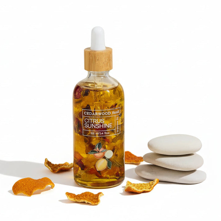 Bottle of 'Citrus Sunshine' essential oil with wooden cap on a neutral background