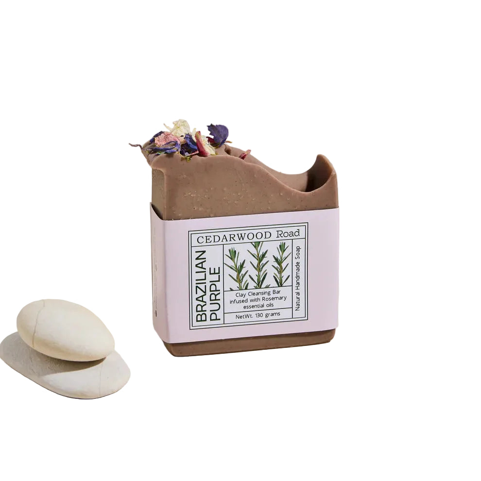 Cedarwood Road Brazilian Purple soap in a box with decorative elements on a beige background