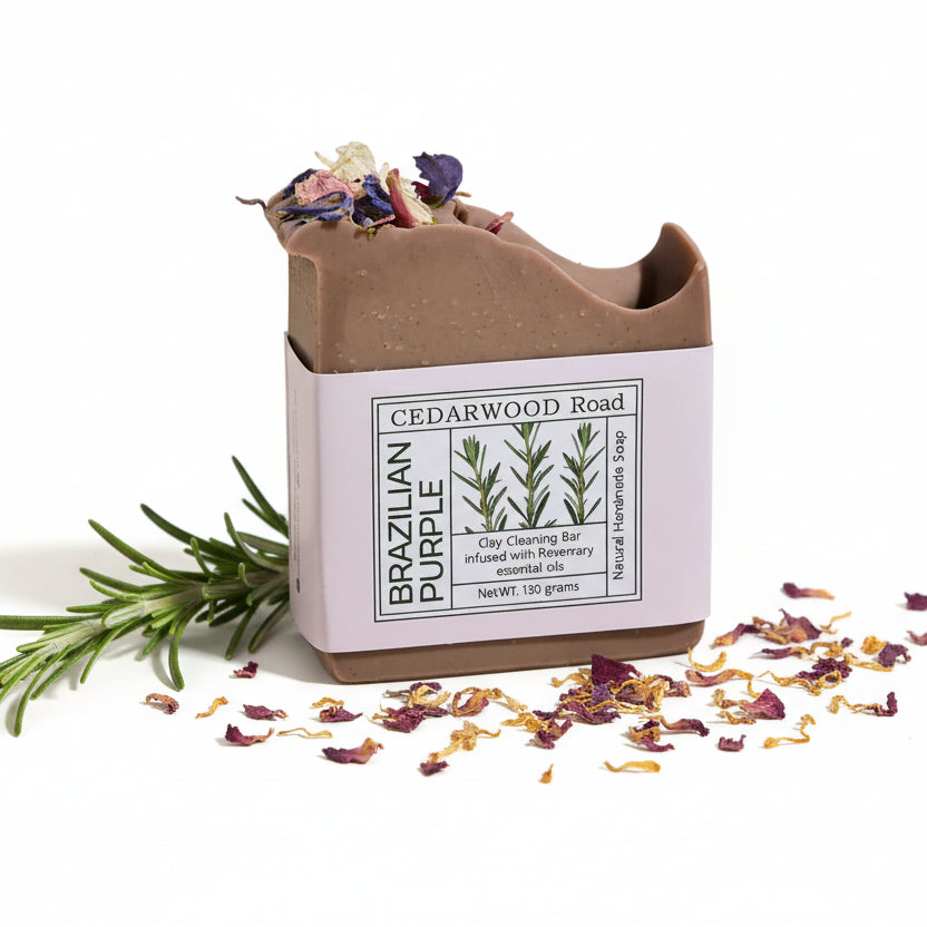 Bar of soap with a decorative container labeled 'Cedarwood Road' on a white background