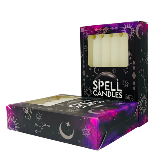 Box of white Spell Candles with mystical designs on a white background