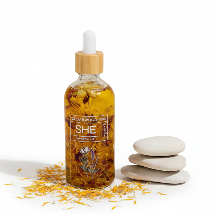Bottle of SHE essential oil with wooden cap on a neutral background