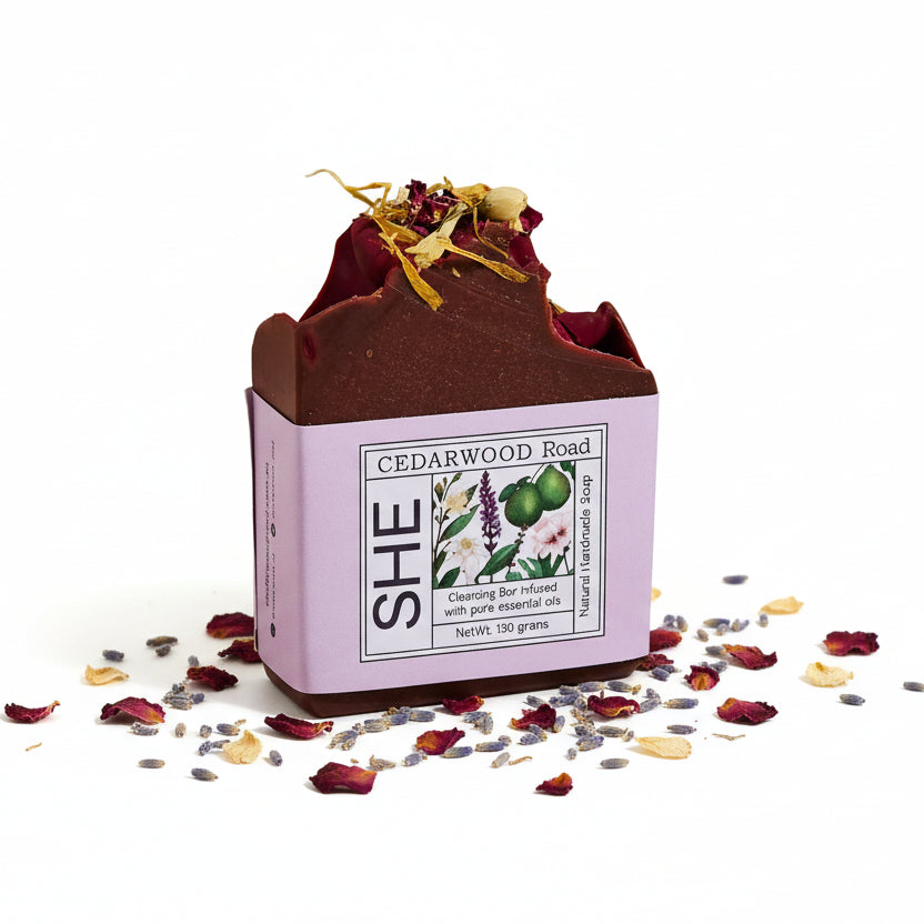 She Cedarwood Road soap bar with packaging on a white background
