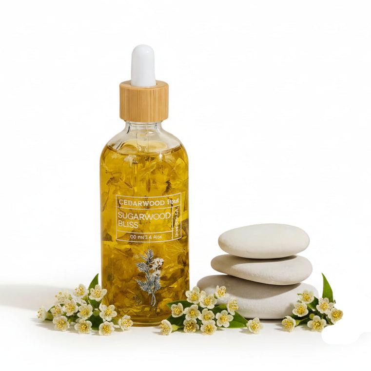 Bottle of cedarwood essential oil with a dropper on a neutral background